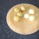 Carefully rub the skin off the cooked and cooled potatoes and discard