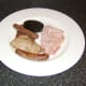 The meat is plated first