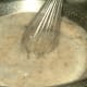 Mix yeast, 3 tbsp of sugar, and salt into the warm water. This is where you would add any extra seasonings, like slices of garlic, for unique flavor profiles.