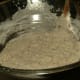 Continue adding flour until batter starts to form.