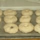 Place formed bagels aside and cover with a light towel. Don't worry if the surface is less than smooth; the boiling and baking process helps to smooth out the bagel somewhat.