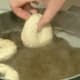 Drop formed bagels in boiling water.