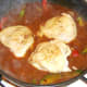 Chicken added to black bean sauce and vegetables