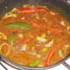 Vegetables and black bean sauce are brought to a simmer