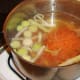 Prepared vegetables are added to chicken stock