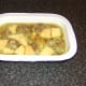 The cooled lamb, turnip and stock is laid in the base of a pie dish