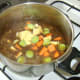 The vegetables are added to the reduced stock and venison