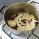 The sliced onion is added to the browned venison