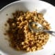 Mix the melted butter, sugar and maple syrup mixture with the chopped nuts.