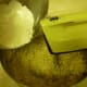 Sifted dry ingredients being added to the mixture.