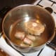 Oxtail is browned in a little oil.