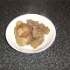 Oxtail pieces are removed from pot.