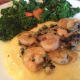 Put a few spoons full of polenta on your plate and place the shrimp on top. Spoon the olive oil, butter, shallot, garlic, caper and basil over the top of the shrimp and polenta. This dish is finished!