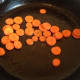 Put your olive oil in the pan to heat up. Once it is hot, add your carrots. Cook for just a minute or two.