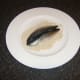 Patting mackerel in oatmeal