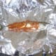 Preparing to wrap the mackerel in foil
