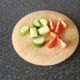 Chopping cucumber and tomato for salad
