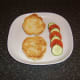 Toasted bread roll and simple salad garnish