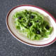 Fresh rocket leaves (arugula) and black olives