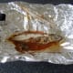 Removing flesh from baked mackerel