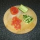 Preparing the tomato and cucumber for salsa
