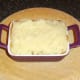 Mashed potato is spread over top.