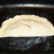 Pasty is laid on greased baking tray and glazed with beaten egg.