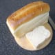 a loaf of bread with one slice cut