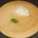 Grated mooli and chopped chives.