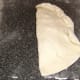 Pastry is folded and crimped.