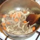 Carrot and onion are mixed through browned beef.