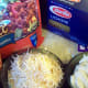 Gather your ingredients for veggie crumble lasagne. Here I used Parmesan, mozzarella, Boca veggie crumbles, ricotta cheese, and lasagne noodles.