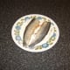 Herring fillets are floured for frying