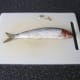 Fins are cut off the scaled herring