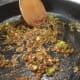 Mix your spices with the sauteed garlic and jalapenos.