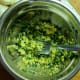 With a fork, mash egg yolks with chives and salt.