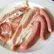 The ingredients for the breakfast: back bacon and beef sausages.