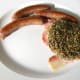 Lavercake is plated on top of the bacon.
