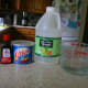 The wet ingredients for Wacky Cake: vanilla extract, vegetable shortening, vinegar, and water.