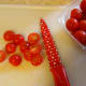 Cut the cherry tomatoes in half.