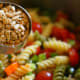 Add the seasoned sunflower seeds and the Italian dressing to the salad. Stir to combine the ingredients and store in the refrigerator for up to 1 week.