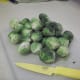 Cut the stems off of the raw brussel sprouts. It's okay if the outer layers fall off. If using frozen brussel sprouts, this step is not necessary because stems are already cut off.