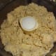 Finely grind the corn and slowly add water