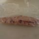 Use the plastic wrap to roll the sausage. This should help shape it further.