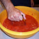 Then, mash them with some sort of masher in a large bowl. A potato masher works well.