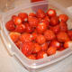 First, take the tops off of the strawberries and clean them.