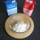 Flour is added to a mixing bowl