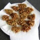 Vegetable pakora is drained before it is plated