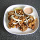 Vegetable pakora is plated, garnished and ready to serve