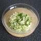 Vegetables are combined in a large bowl